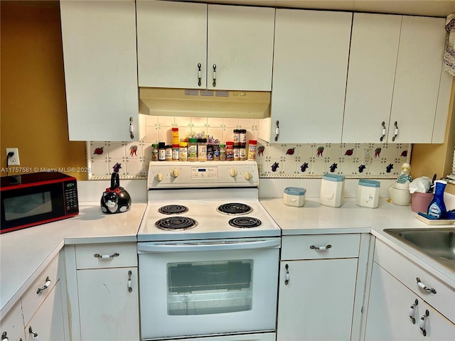 kitchen featuring under cabinet range hood, tasteful backsplash, light countertops, and white range with electric cooktop