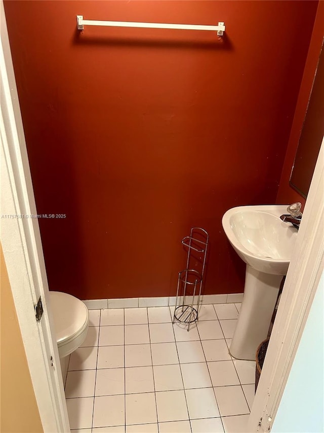 bathroom featuring tile patterned floors and toilet