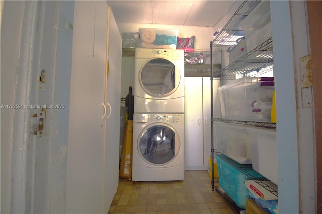 laundry room with laundry area and stacked washer / drying machine