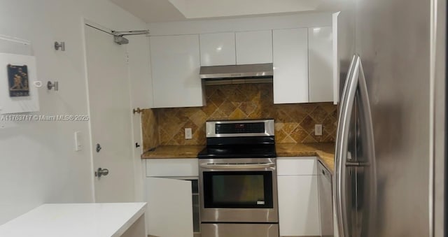 kitchen with decorative backsplash, under cabinet range hood, white cabinets, and appliances with stainless steel finishes