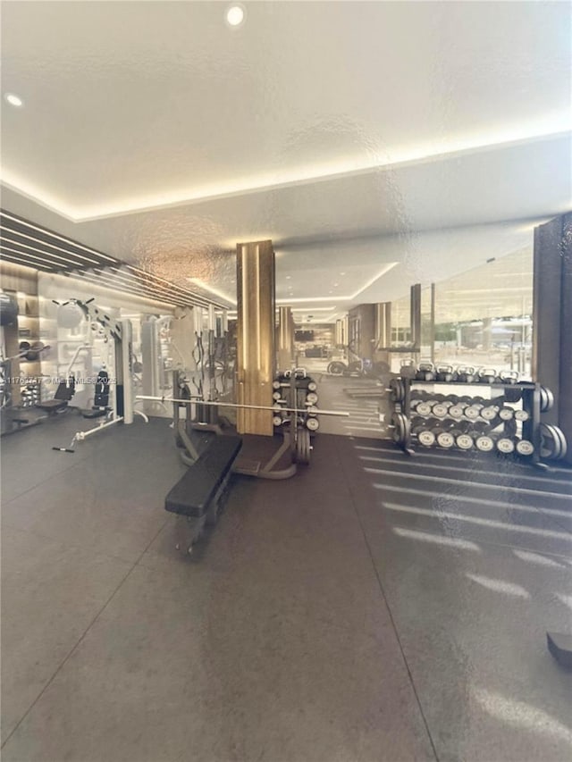 workout area featuring a textured ceiling