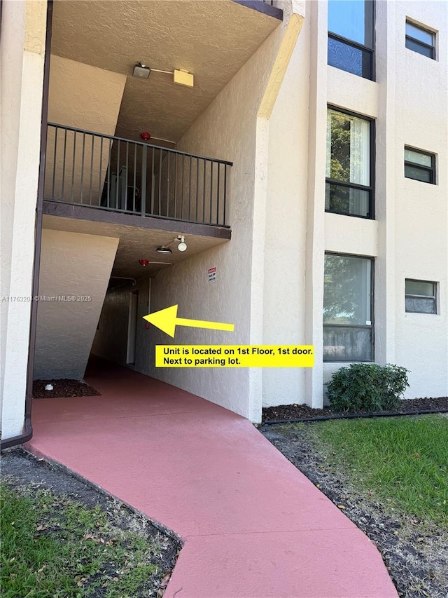 doorway to property with stucco siding