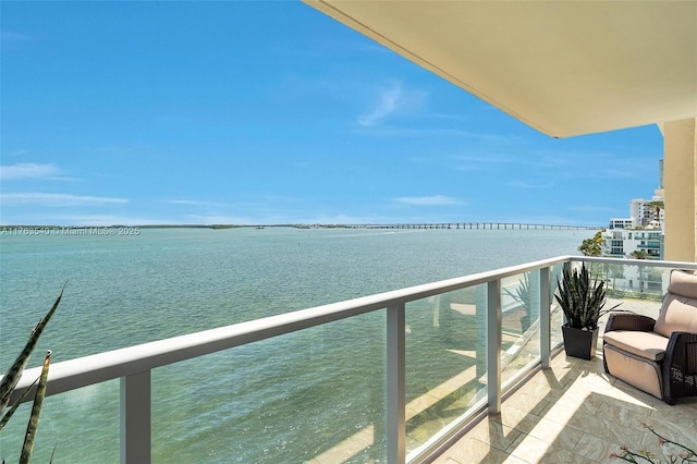 balcony featuring a water view