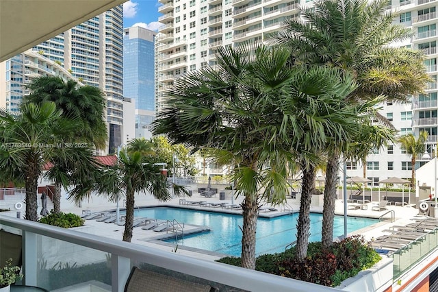 view of pool with a view of city