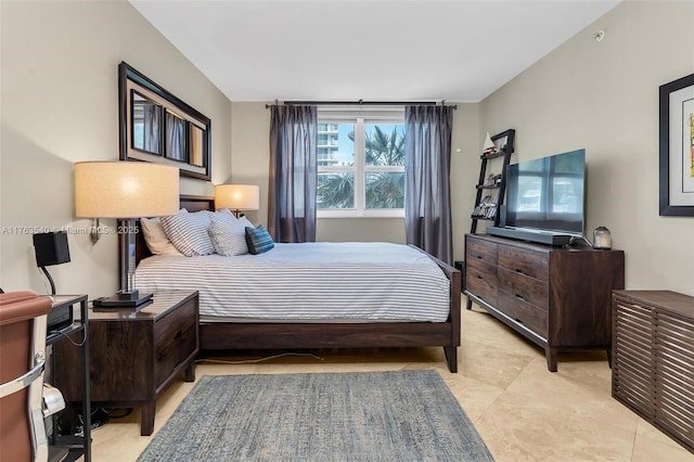 bedroom with light tile patterned floors