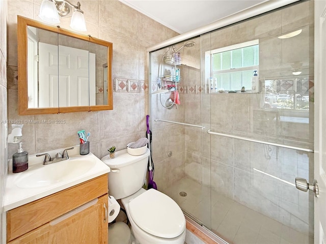 bathroom featuring vanity, a shower stall, tile walls, toilet, and backsplash