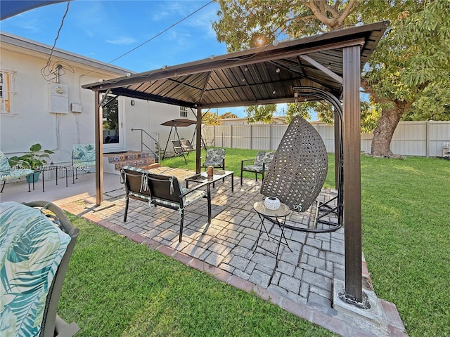 view of patio featuring a gazebo and a fenced backyard