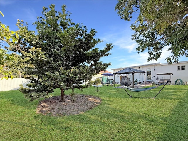 view of yard featuring a gazebo and fence