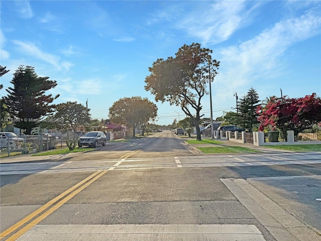 view of road featuring a residential view and sidewalks