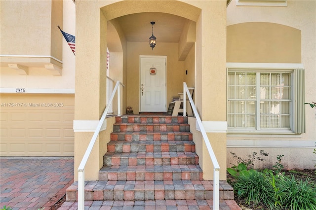 entrance to property with stucco siding