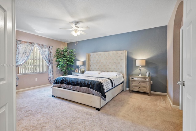 bedroom with baseboards, carpet, and a ceiling fan