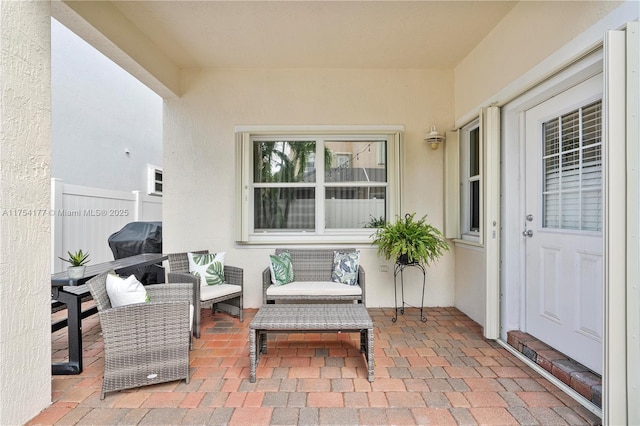 view of patio / terrace featuring fence