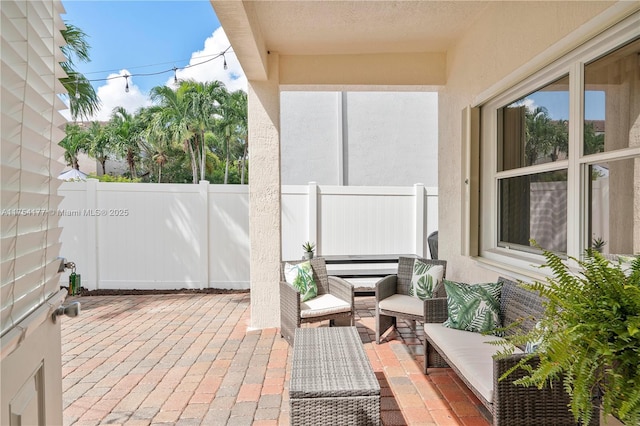 view of patio with an outdoor hangout area and a fenced backyard