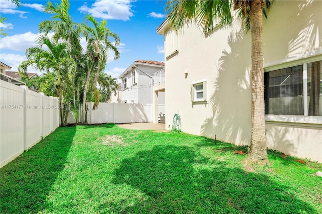 view of yard with a patio area and a fenced backyard