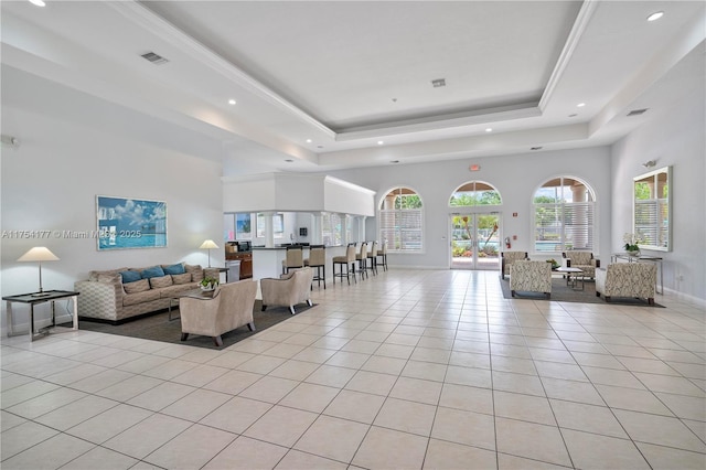 living room featuring visible vents, recessed lighting, baseboards, light tile patterned flooring, and a raised ceiling