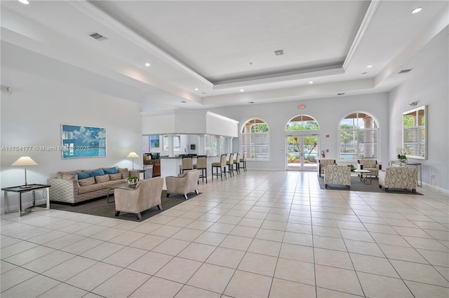 7546 NW 18th Dr, Pembroke Pines, FL 33024 - living area featuring light tile patterned flooring, visible vents, recessed lighting, a tray ceiling, and baseboards