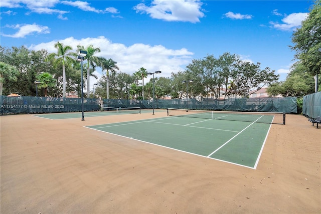 view of sport court with community basketball court and fence