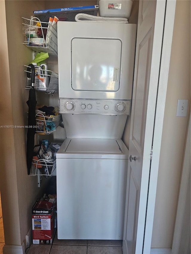 washroom featuring laundry area and stacked washer and clothes dryer