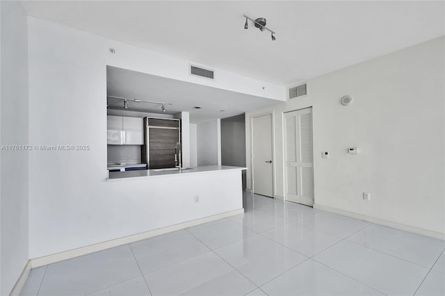 1100 S Miami Ave Unit 1103, Miami, FL 33130 - empty room featuring rail lighting and light tile patterned floors