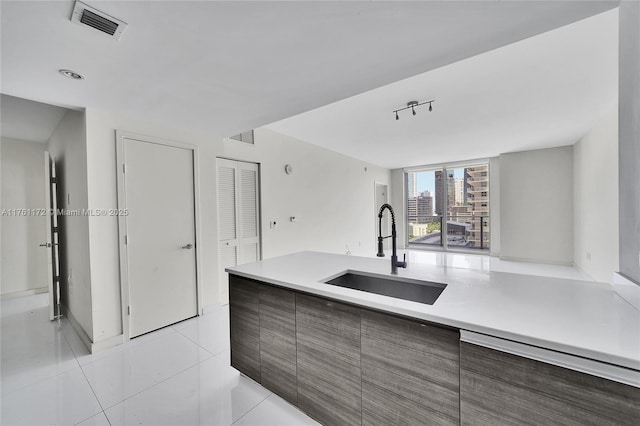 1100 S Miami Ave Unit 1103, Miami, FL 33130 - kitchen with light countertops, light tile patterned floors, and modern cabinets