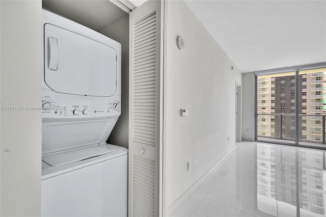 1100 S Miami Ave Unit 1103, Miami, FL 33130 - washroom with stacked washer / drying machine and baseboards