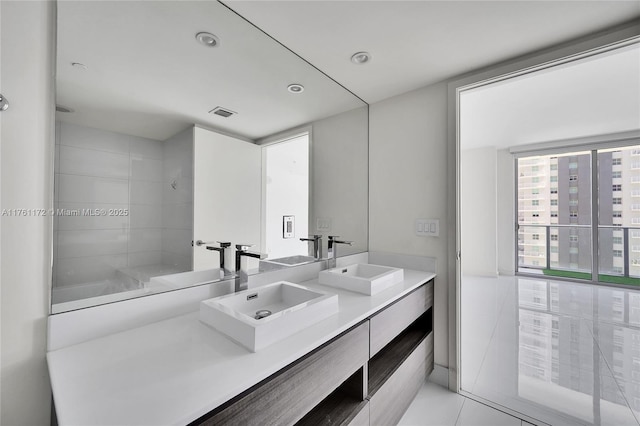 1100 S Miami Ave Unit 1103, Miami, FL 33130 - full bathroom with double vanity, tile patterned floors, and recessed lighting