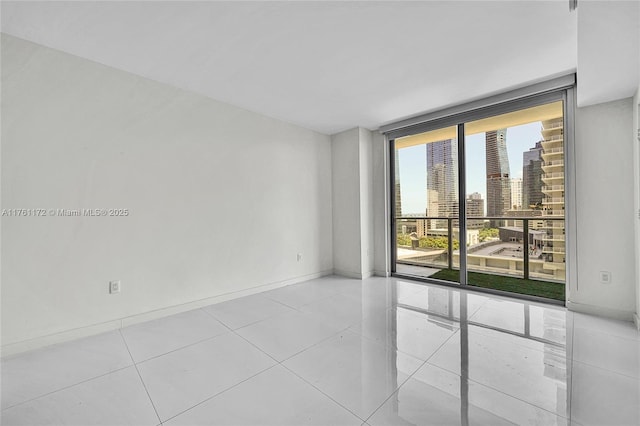 1100 S Miami Ave Unit 1103, Miami, FL 33130 - tiled spare room with expansive windows and a view of city
