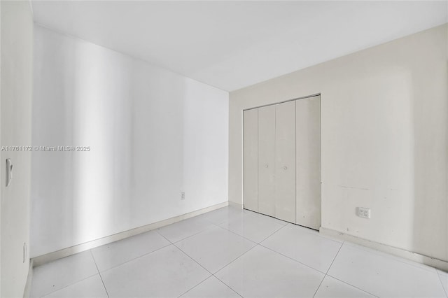 1100 S Miami Ave Unit 1103, Miami, FL 33130 - unfurnished bedroom with a closet and light tile patterned flooring