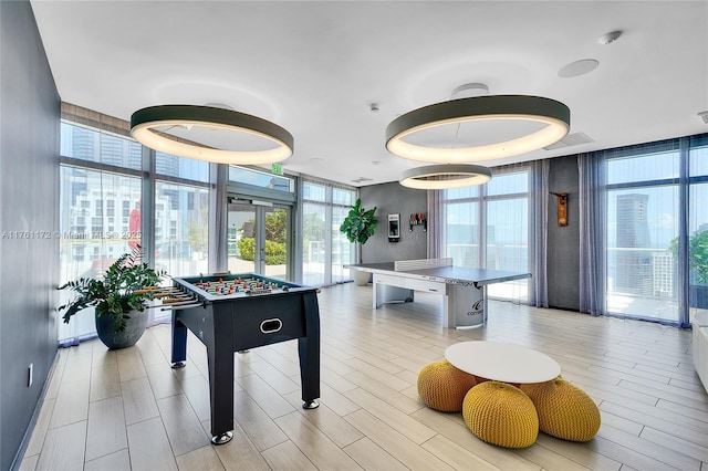 1100 S Miami Ave Unit 1103, Miami, FL 33130 - rec room with floor to ceiling windows and light wood-style flooring