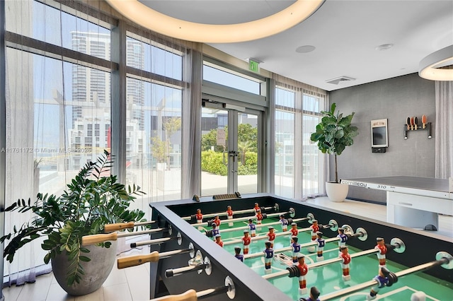 1100 S Miami Ave Unit 1103, Miami, FL 33130 - game room featuring french doors, healthy amount of natural light, and tile patterned floors