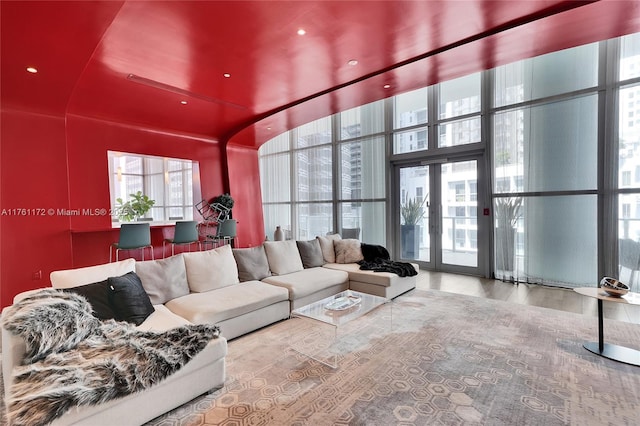 1100 S Miami Ave Unit 1103, Miami, FL 33130 - living room featuring a towering ceiling, a wall of windows, and wood finished floors