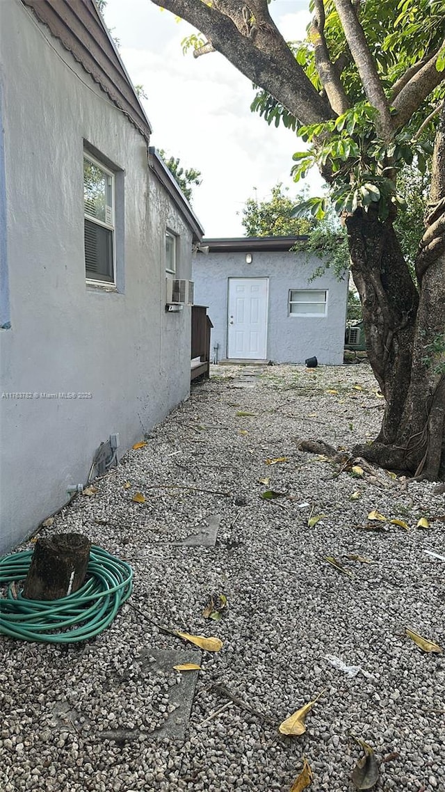 view of side of home featuring stucco siding