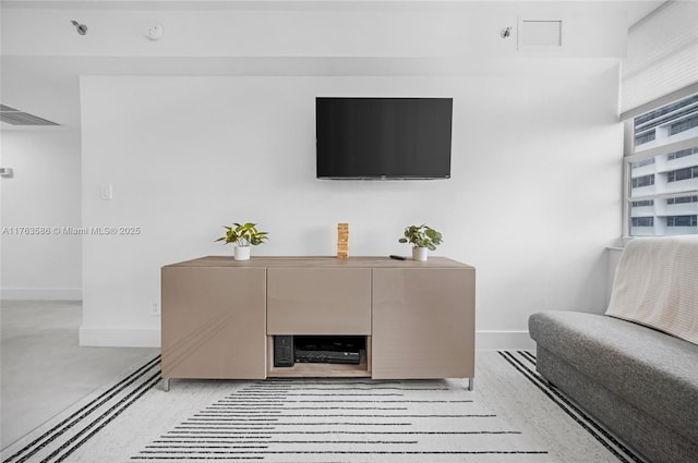 living room with visible vents and baseboards