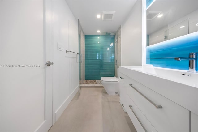 bathroom featuring tile patterned floors, visible vents, toilet, a shower stall, and vanity