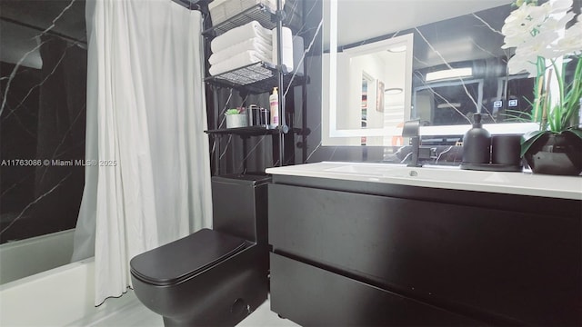 full bathroom featuring shower / bath combo with shower curtain and vanity