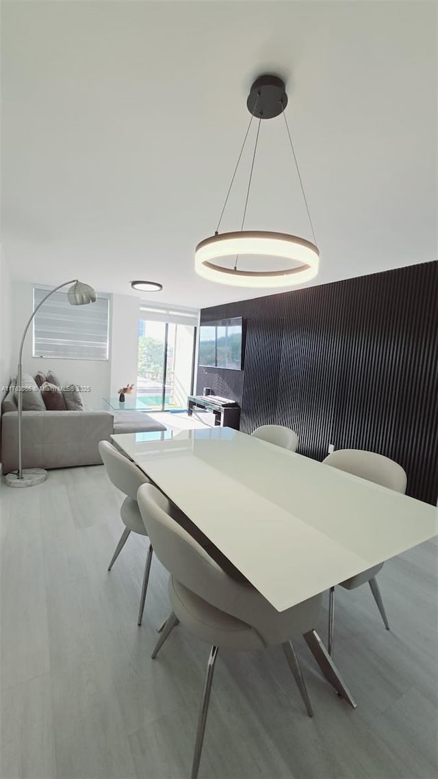 dining space with light wood-style floors