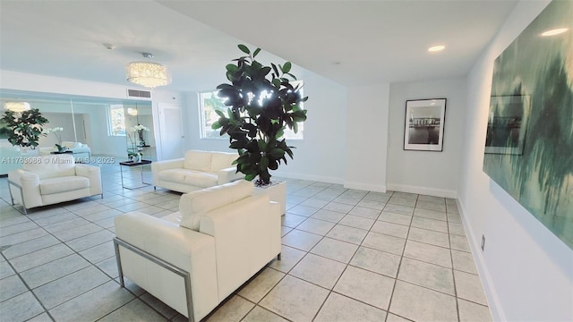 living area featuring recessed lighting, light tile patterned floors, visible vents, and baseboards