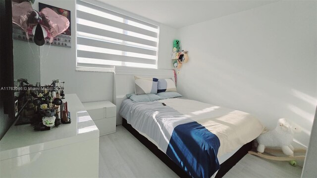 2821 N Miami Beach Blvd Unit 4F, North Miami Beach, FL 33160 - bedroom with wood finished floors