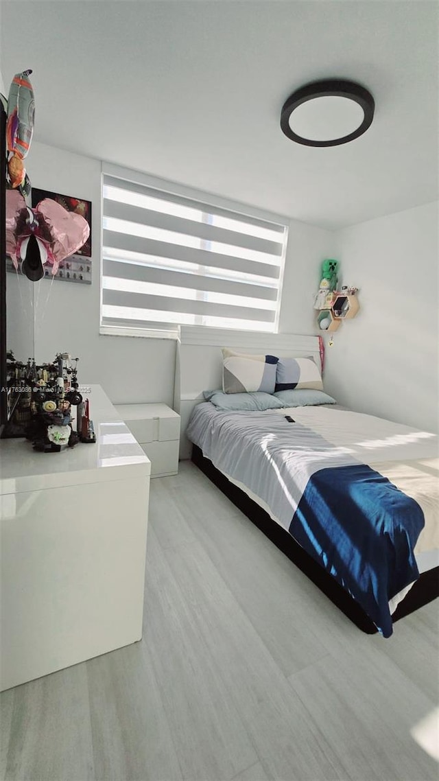 bedroom featuring wood finished floors