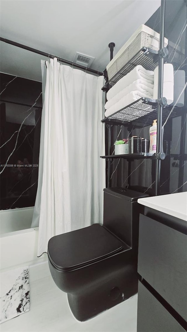 2821 N Miami Beach Blvd Unit 4F, North Miami Beach, FL 33160 - bathroom with shower / bath combo with shower curtain and vanity