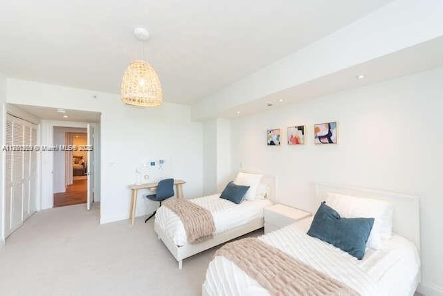 bedroom with light colored carpet