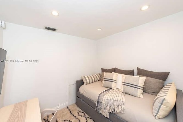 bedroom with carpet flooring, recessed lighting, visible vents, and baseboards