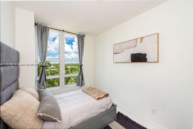 bedroom featuring baseboards