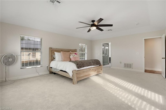 carpeted bedroom with visible vents, baseboards, and ceiling fan