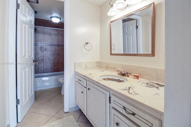 full bath featuring shower / bathing tub combination, toilet, vanity, and tile patterned flooring