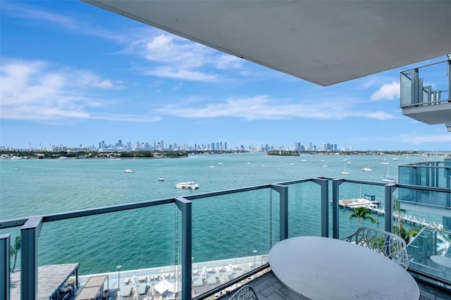 balcony with a city view and a water view