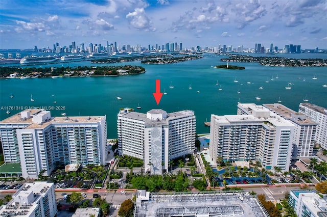 drone / aerial view with a view of city and a water view