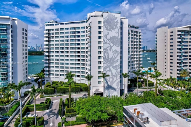 view of property with a view of city and a water view