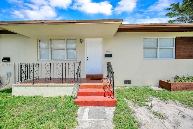 11003 NE 12th Ave, Miami, FL 33161 - entrance to property featuring crawl space and stucco siding