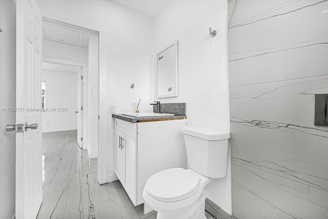 11003 NE 12th Ave, Miami, FL 33161 - bathroom with toilet, marble finish floor, vanity, and baseboards